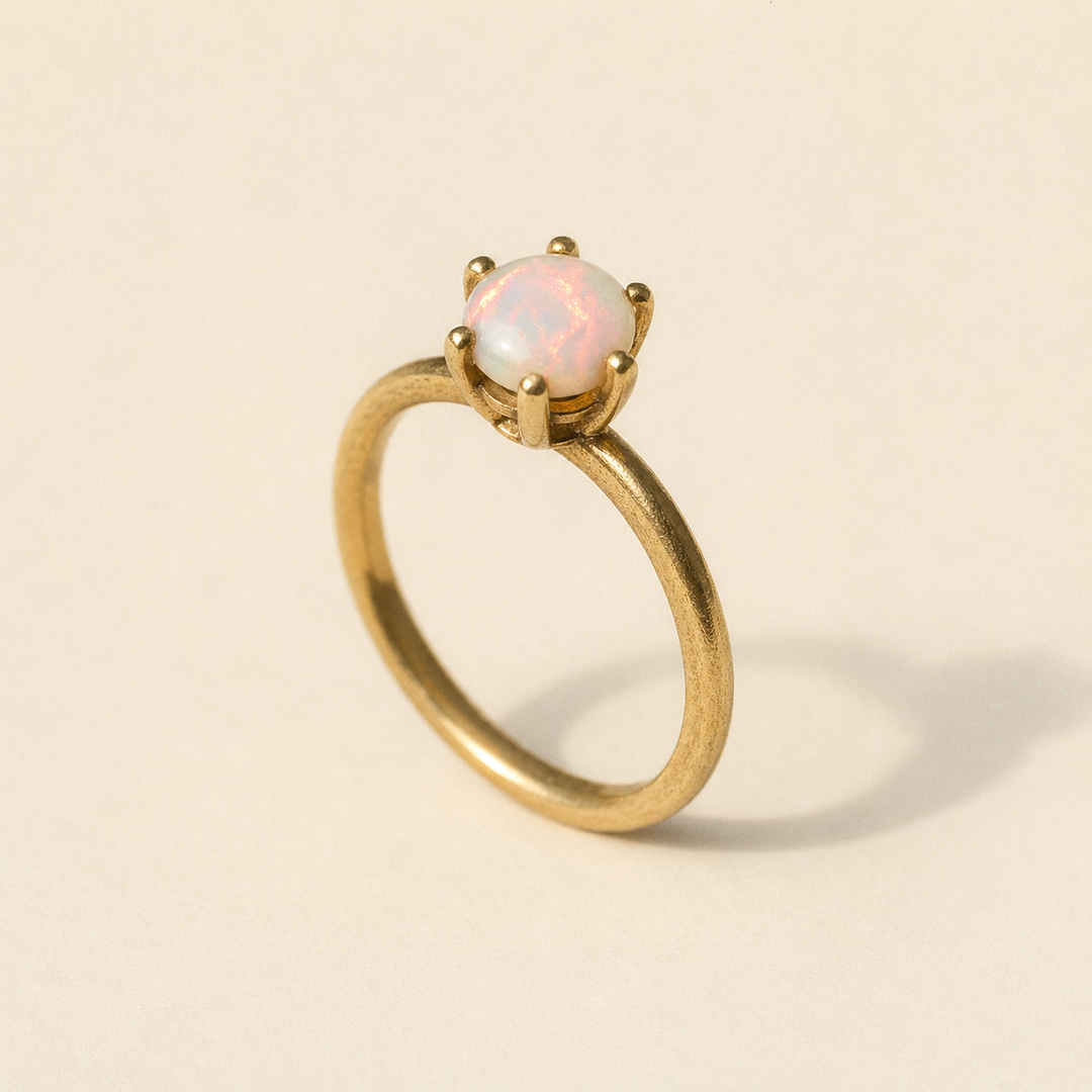 Vintage gold-plated opal solitaire ring with milky white stone