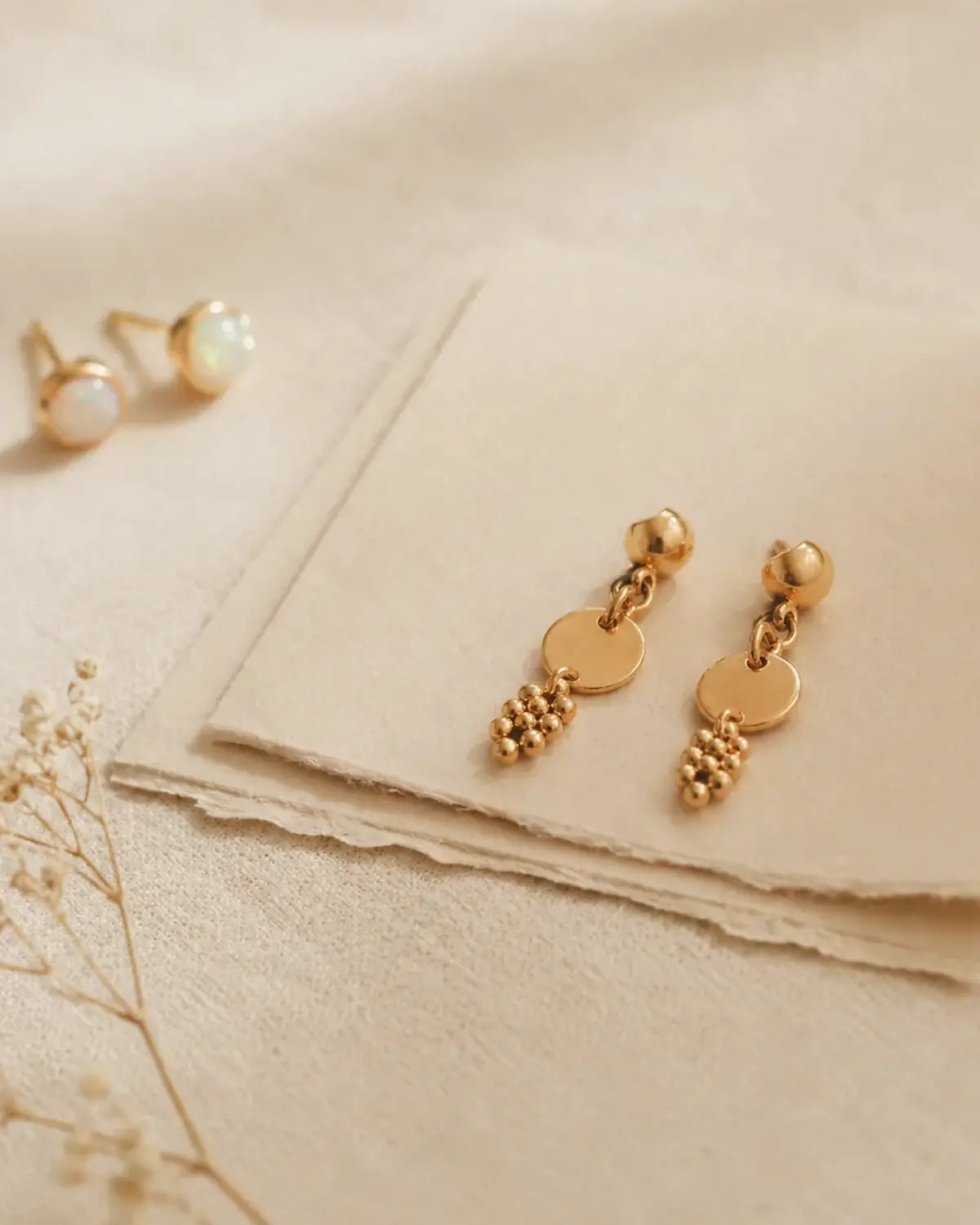 Heart and Hazel gold earrings on soft ivory card