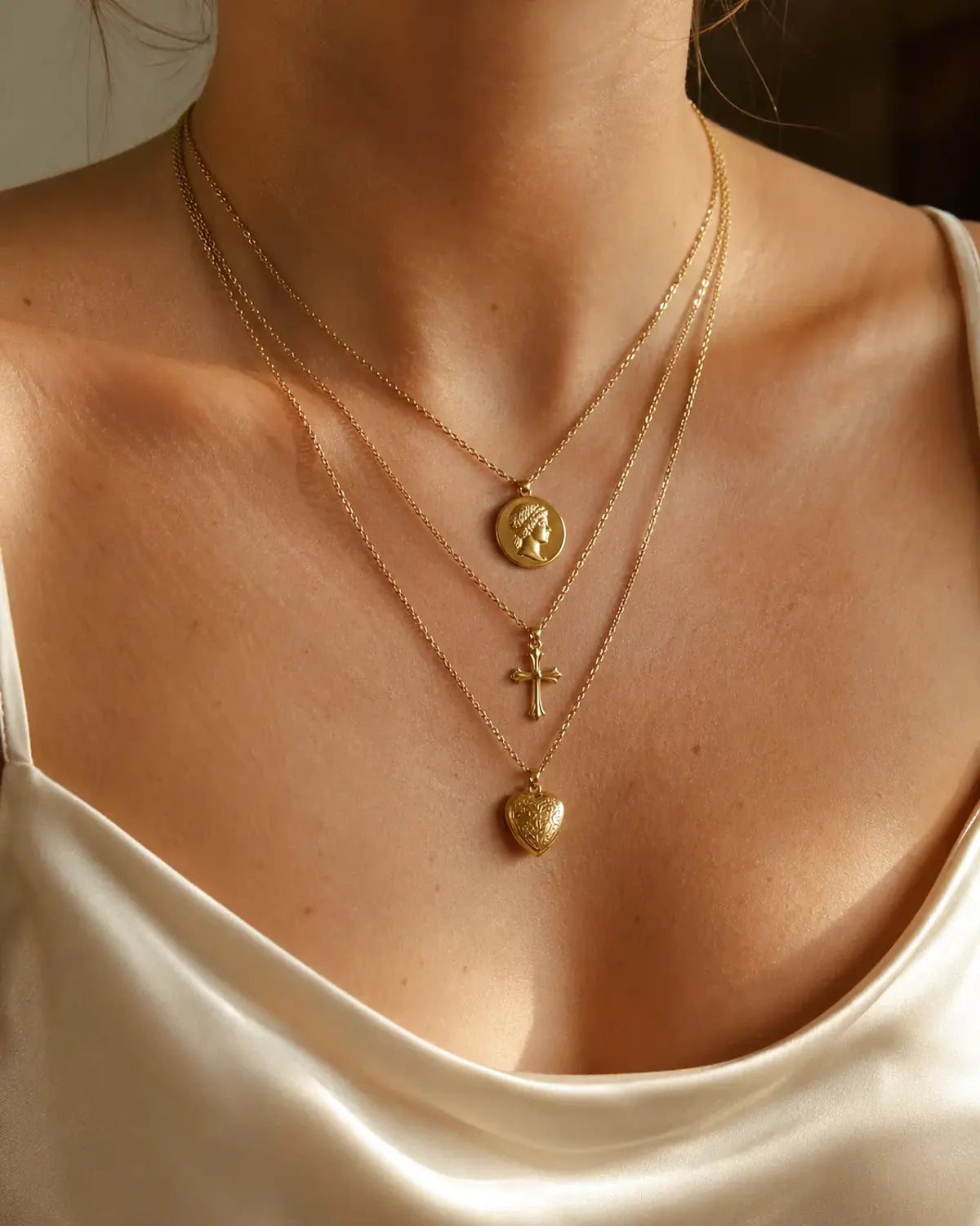 Heart and Hazel layered gold necklaces styled on model
